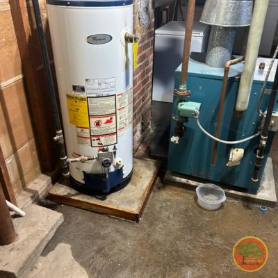 water leak water Heater Leaking in a basement.